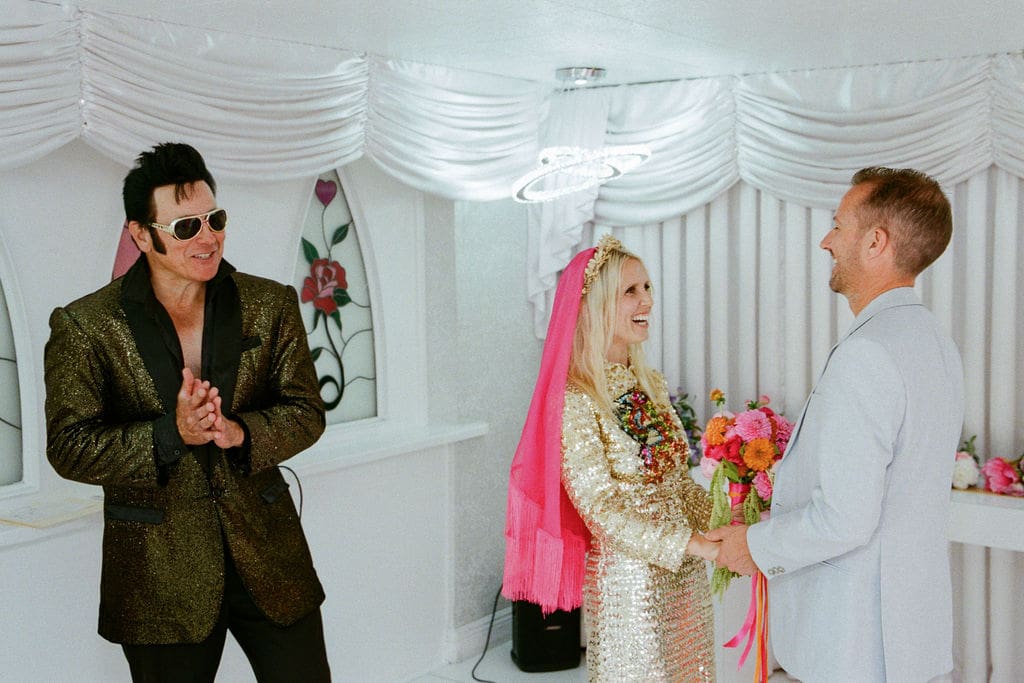 bride and groom holding hands during their wedding ceremony