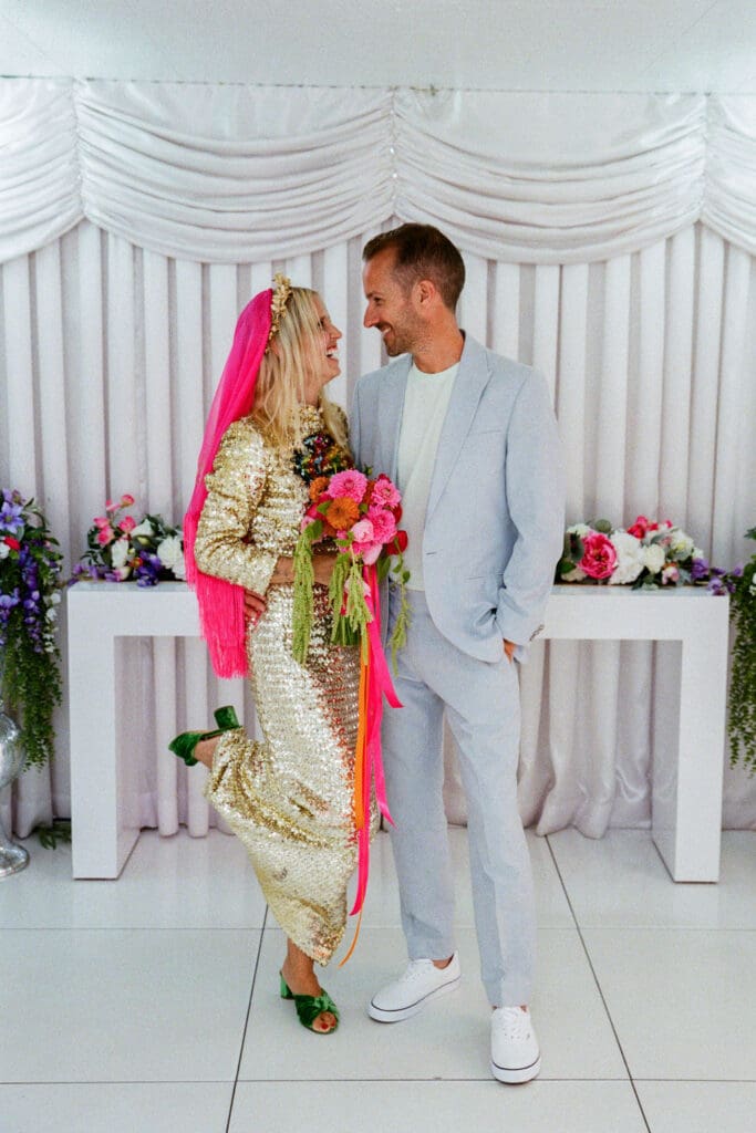 cute picture of the newlyweds smiling at each other