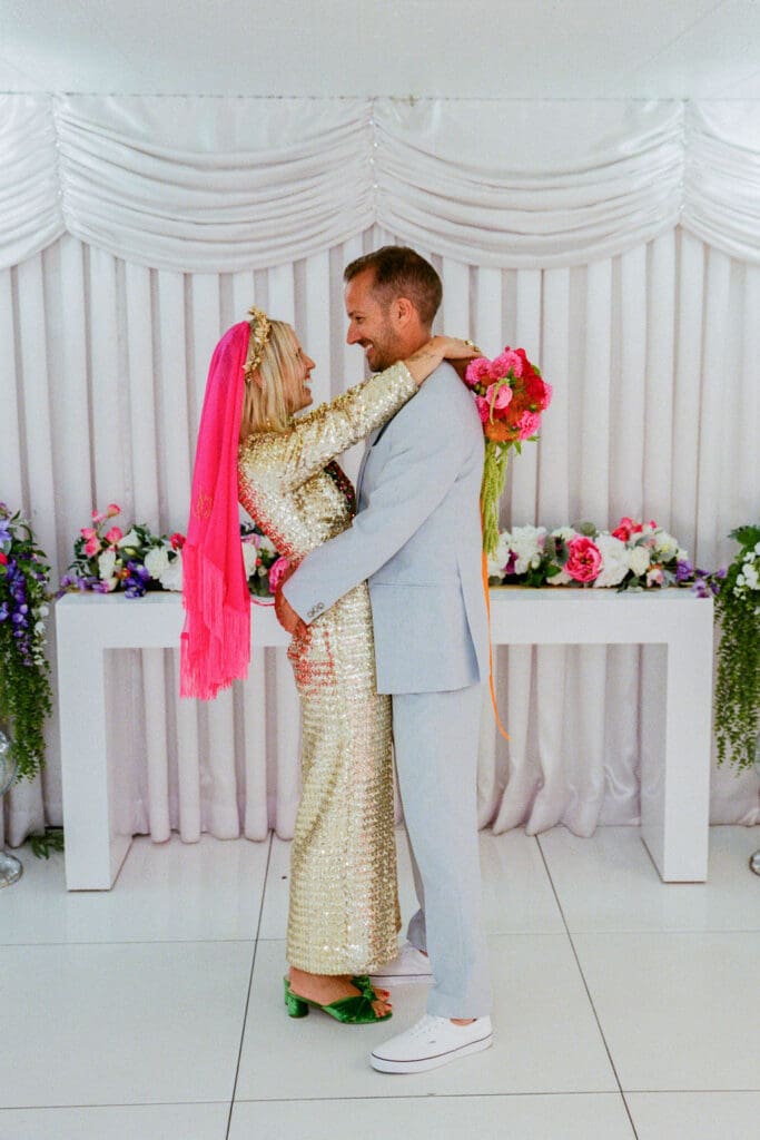 cute picture of the bride and groom hugging