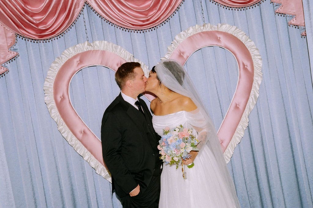 cute picture of the newlyweds kissing