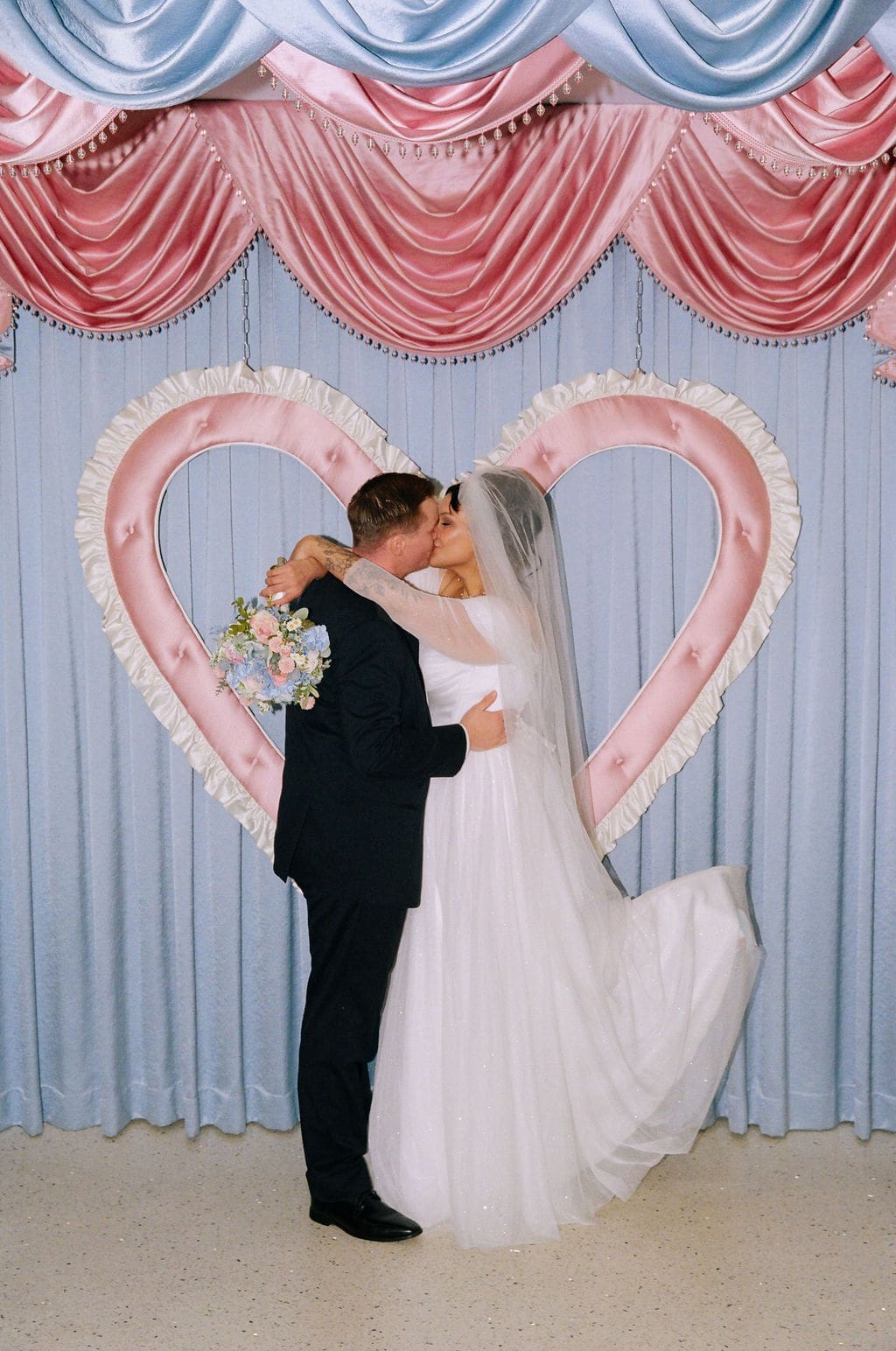 bride and groom kissing after their wedding ceremony