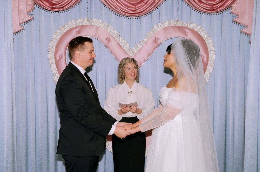 cute picture of the newlyweds holding hands