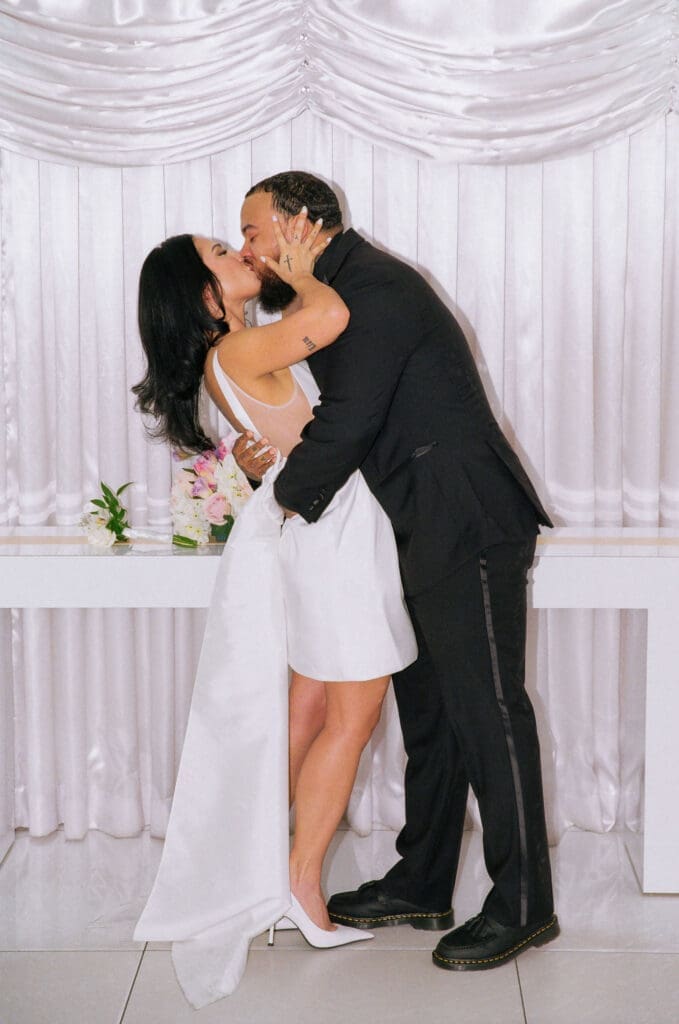 cute picture of the newlyweds kissing