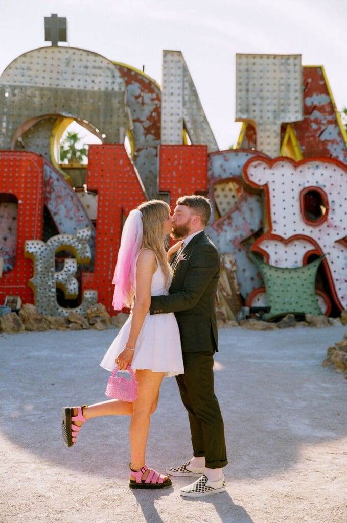 cute picture of the bride and groom kissing during their photoshoot