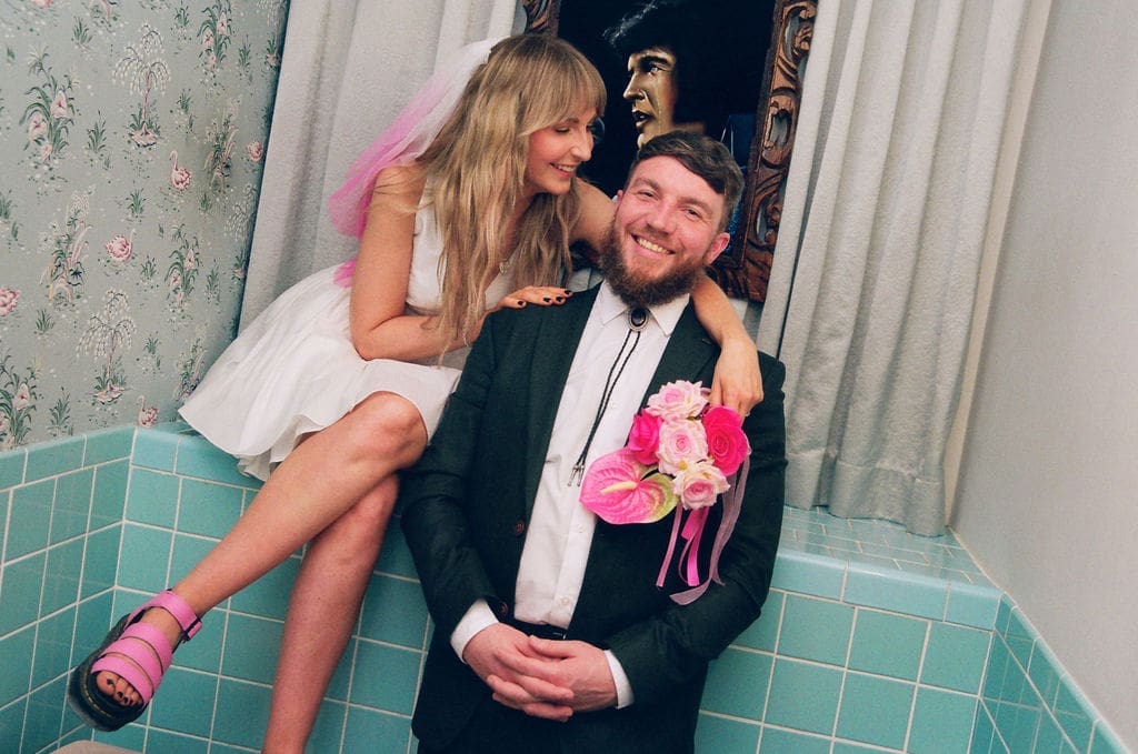 newlyweds laughing with each other during their photoshoot