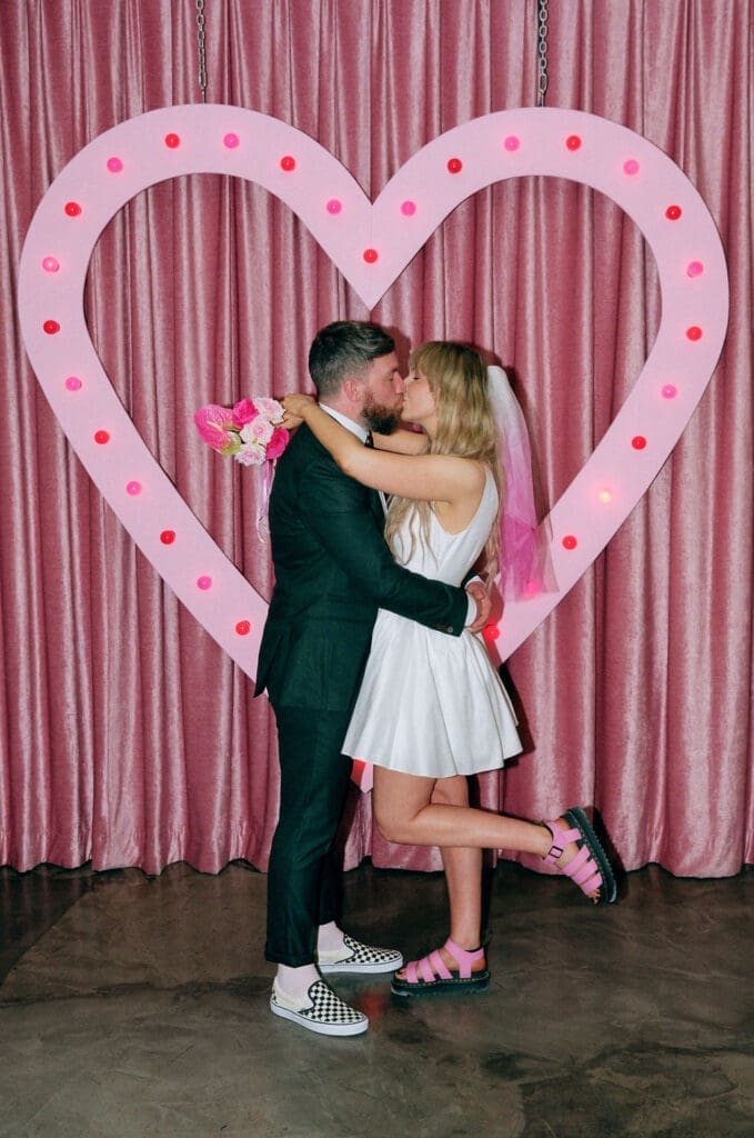 Portrait of the newly married couple kissing