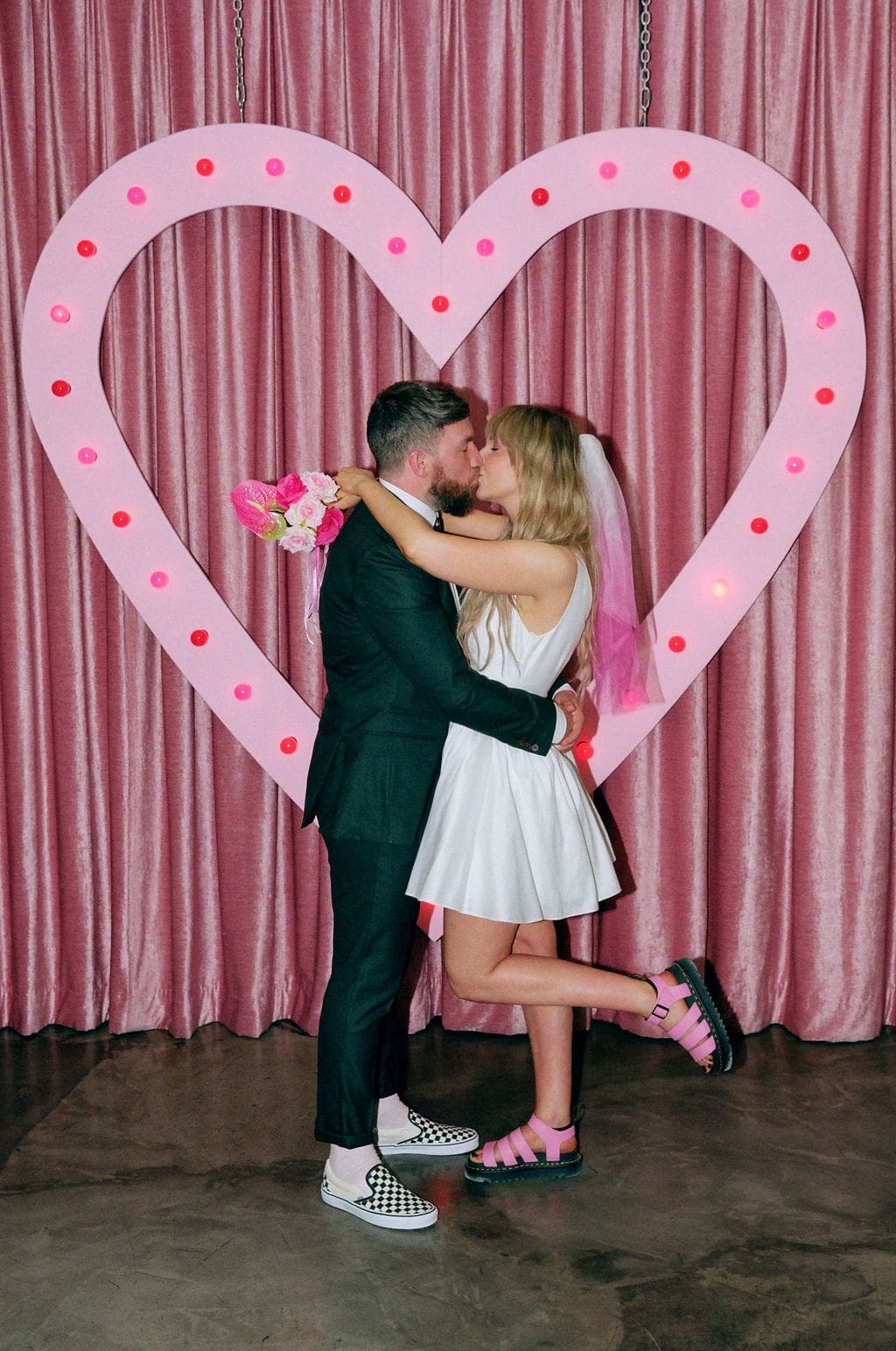 Portrait of the newly married couple kissing