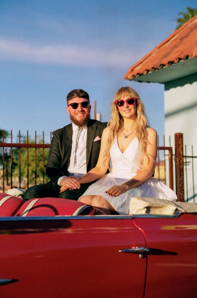 Couple smiling at the camera during their photo shoot