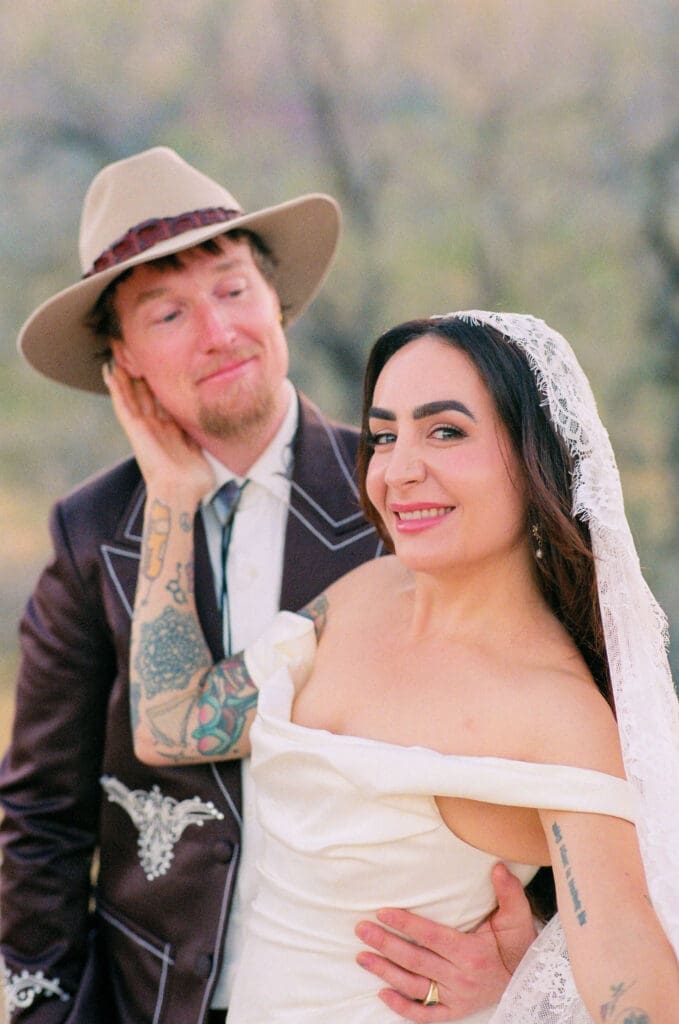 couple smiling at each other during their bridal session