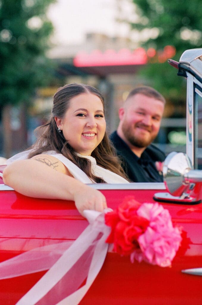couple smiling at the camera during their photoshoot