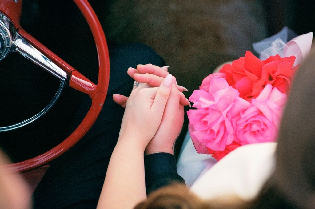 cute picture of the newlyweds holding hands