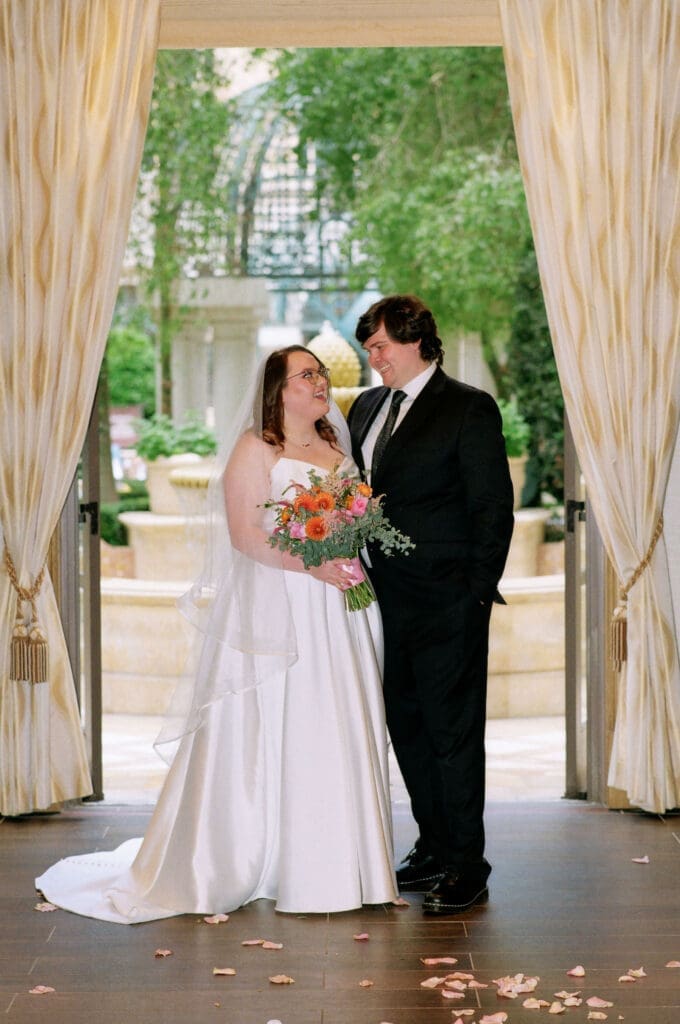 cute picture of the newlyweds smiling at each other