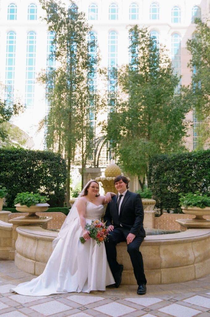 couple smiling at the camera during their photoshoot