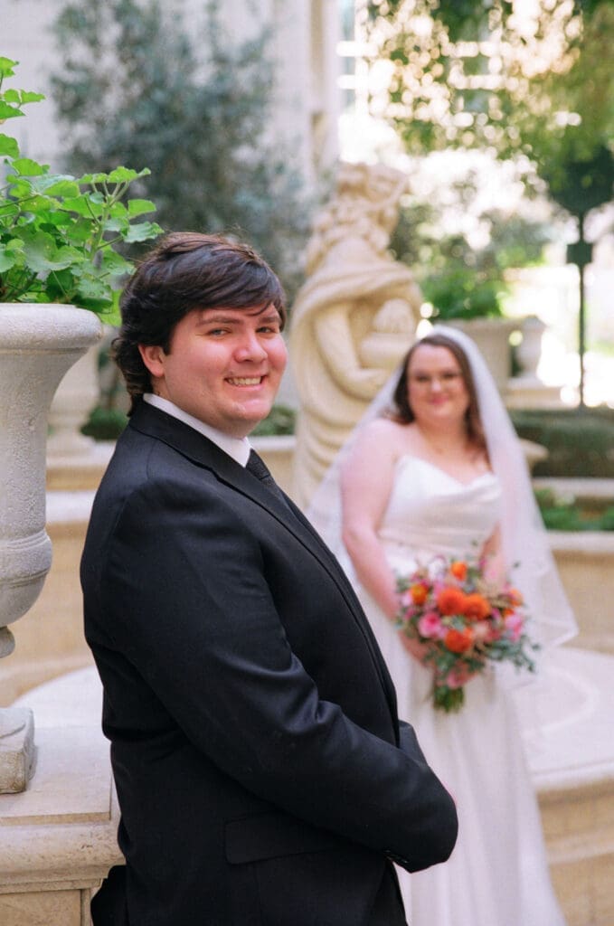 newlyweds smiling at the camera during their bridal session