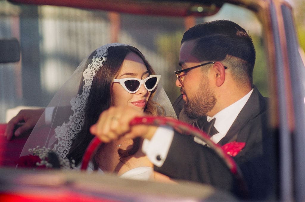 portrait of the newlyweds smiling at each other