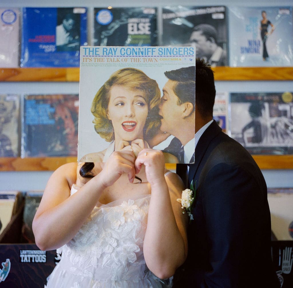 groom kissing the bride on the cheek