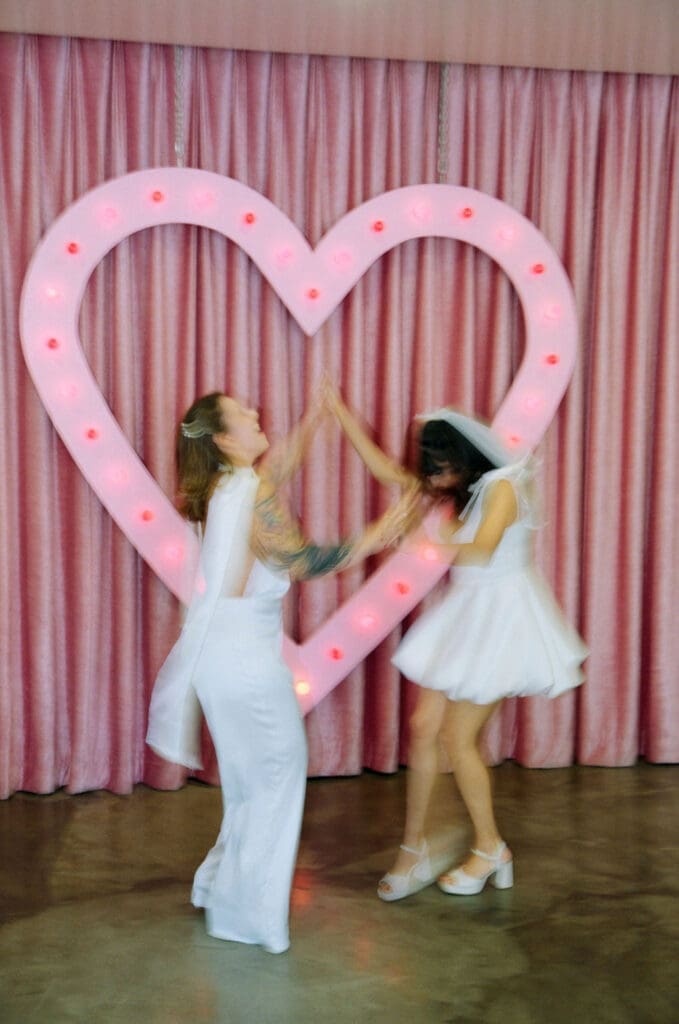 newlyweds dancing during their photoshoot