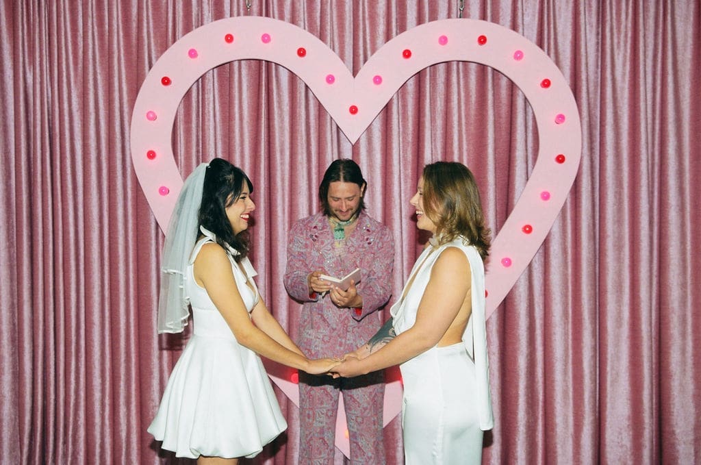 couple holding hands during their ceremony