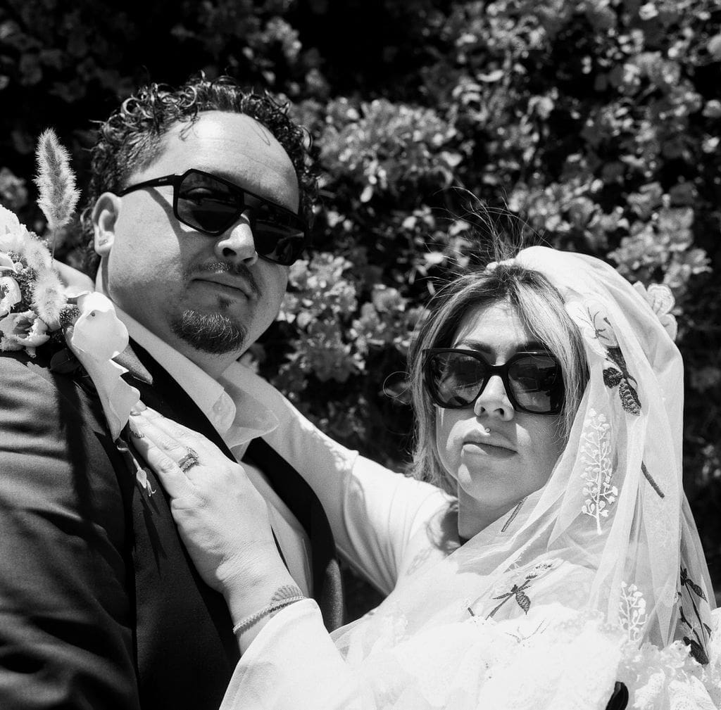 couple posing for the camera during their photoshoot