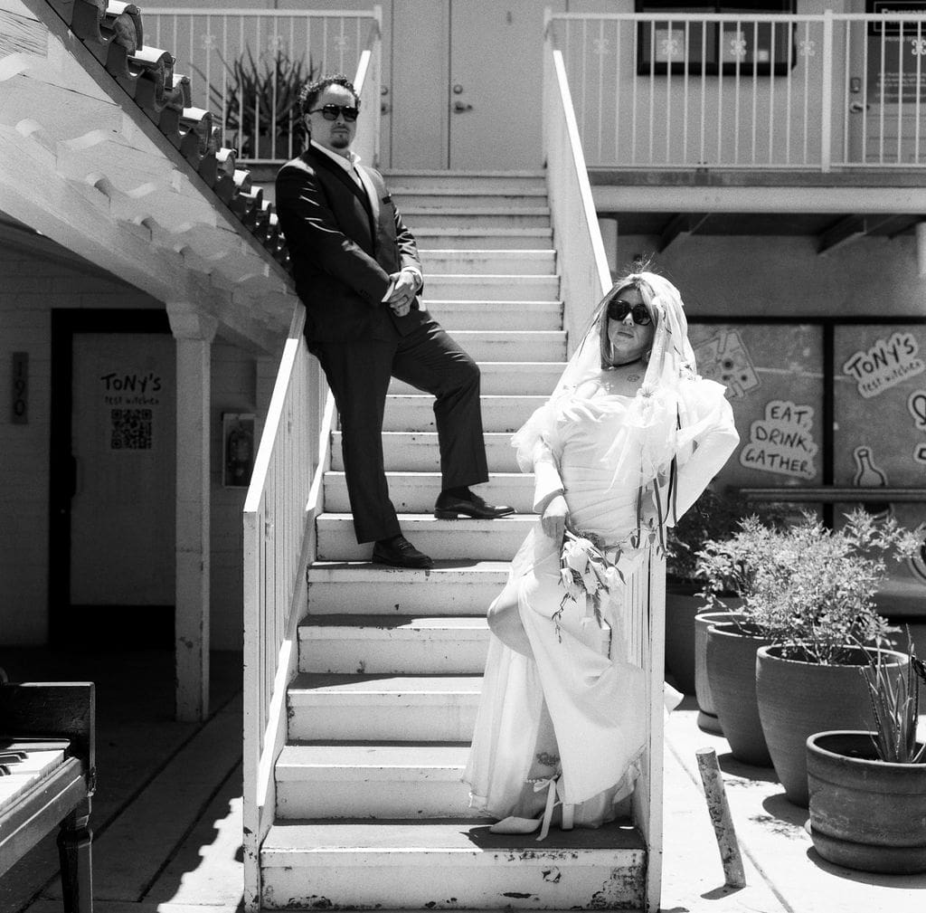 bride and groom smiling at each other during their photoshoot
