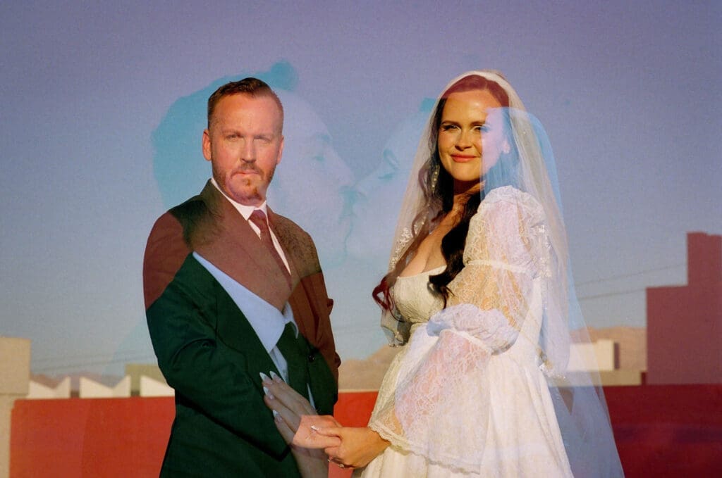 cute picture of the bride and groom holding hands
