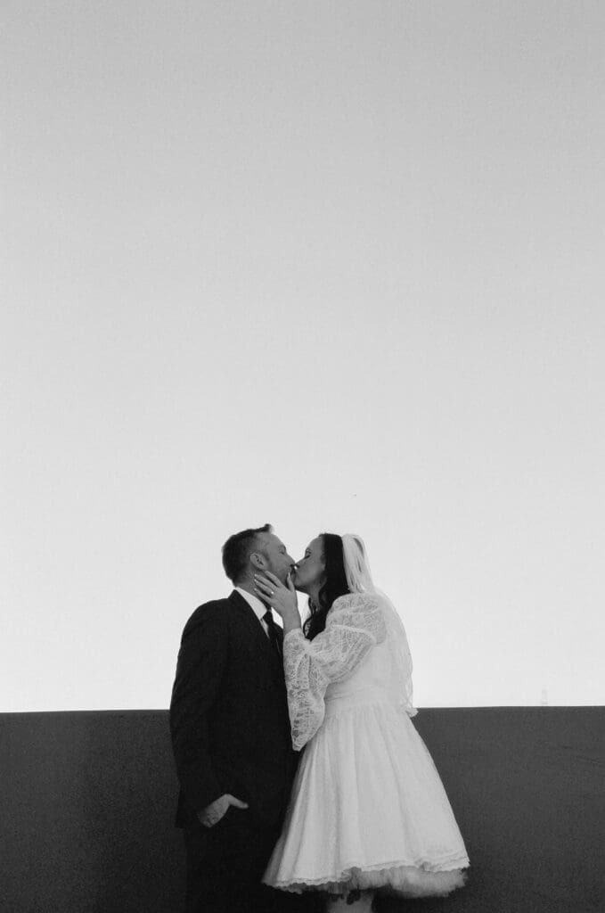 cute picture of the bride and groom kissing