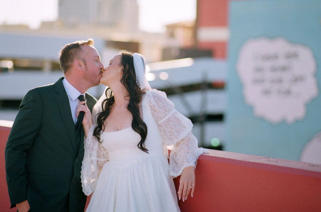 romantic portraits of the newlyweds kissing