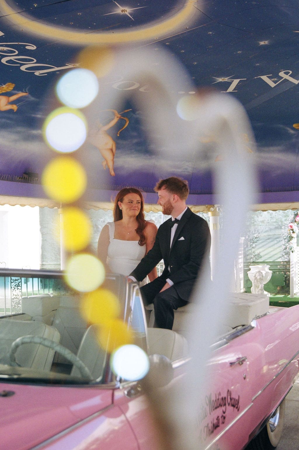Cute picture of the bride and groom, smiling at each other