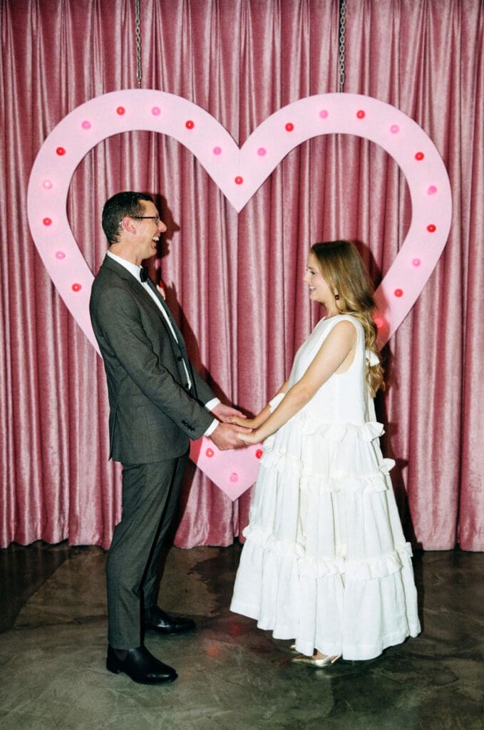 bride and groom holding hands during their ceremony
