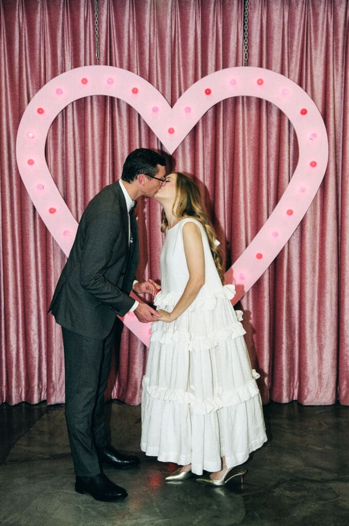 cute picture of the newlyweds kissing after their ceremony