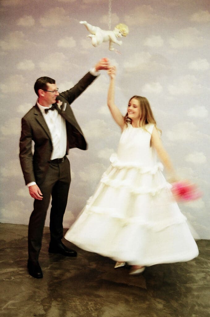 cute picture of the newlyweds dancing during their photoshoot